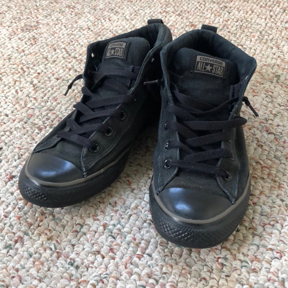 Black Converse Chuck Taylor’s shoes